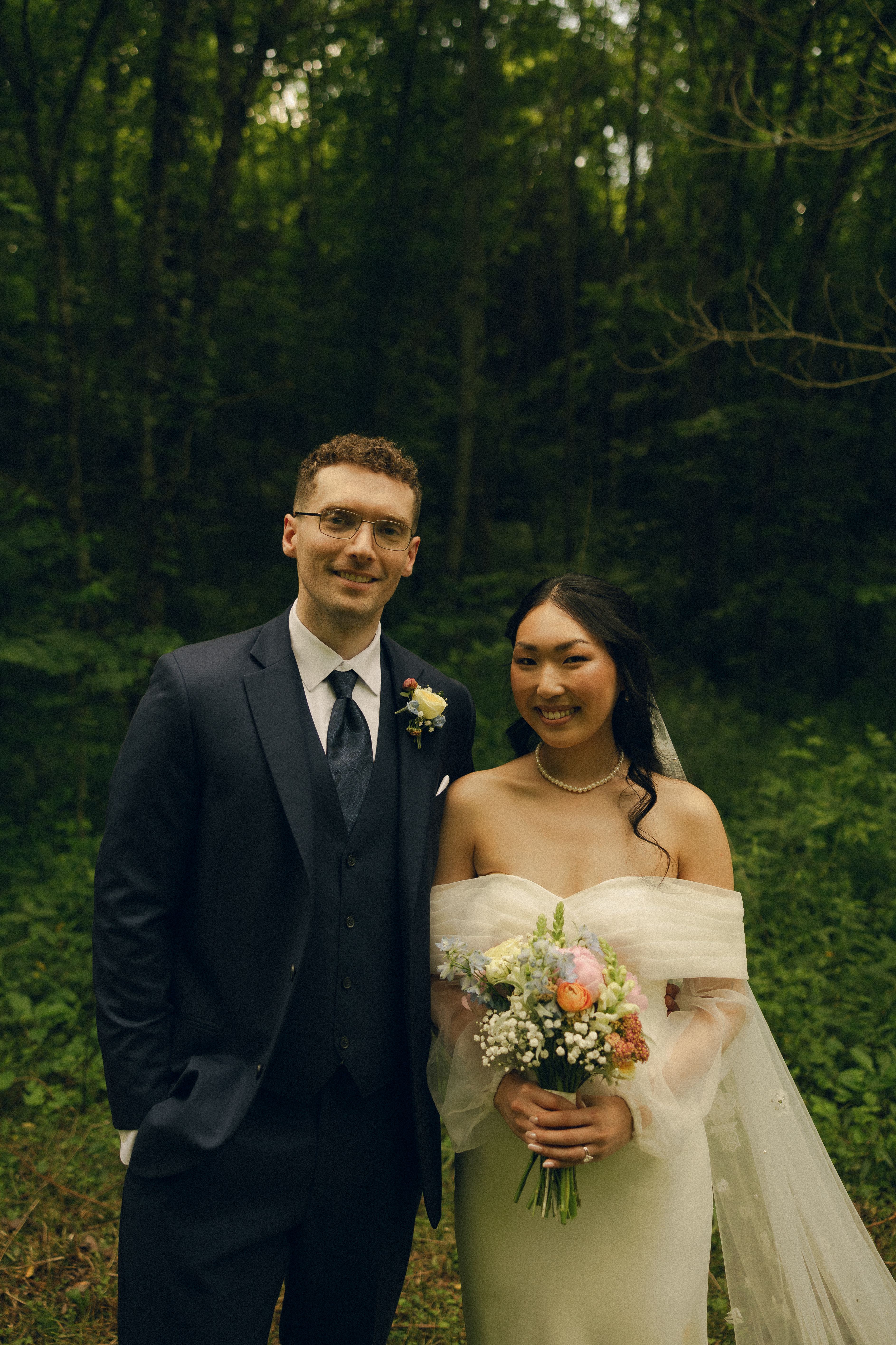 Couple portrait in lush forest setting